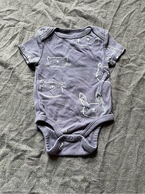 Cloud Island blue baby boy onesie with white animal print.
